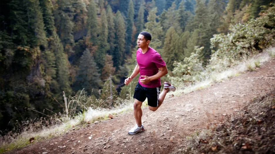 physically fit male running in the mountains to illustrate fitness training in high altitudes