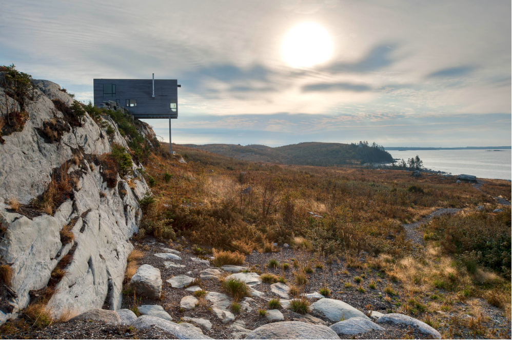 Poised dramatically over the Atlantic on the windswept cliffs of Nova Scotia, the Cliff House by MacKay-Lyons Sweetapple Architects anchors into the rocky coastline by steel stilts