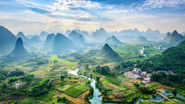 Guilin, China's magical mountain peaks. Photo Courtesy of aphotostory/Getty via Architectural Digest